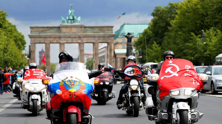 Members of the Night Wolves motorcycle group arrive to take part in celebrations to mark Victory Day at Brandenburg Gate in Berlin, Germany, May 9, 2019. REUTERS/Fabrizio Bensch